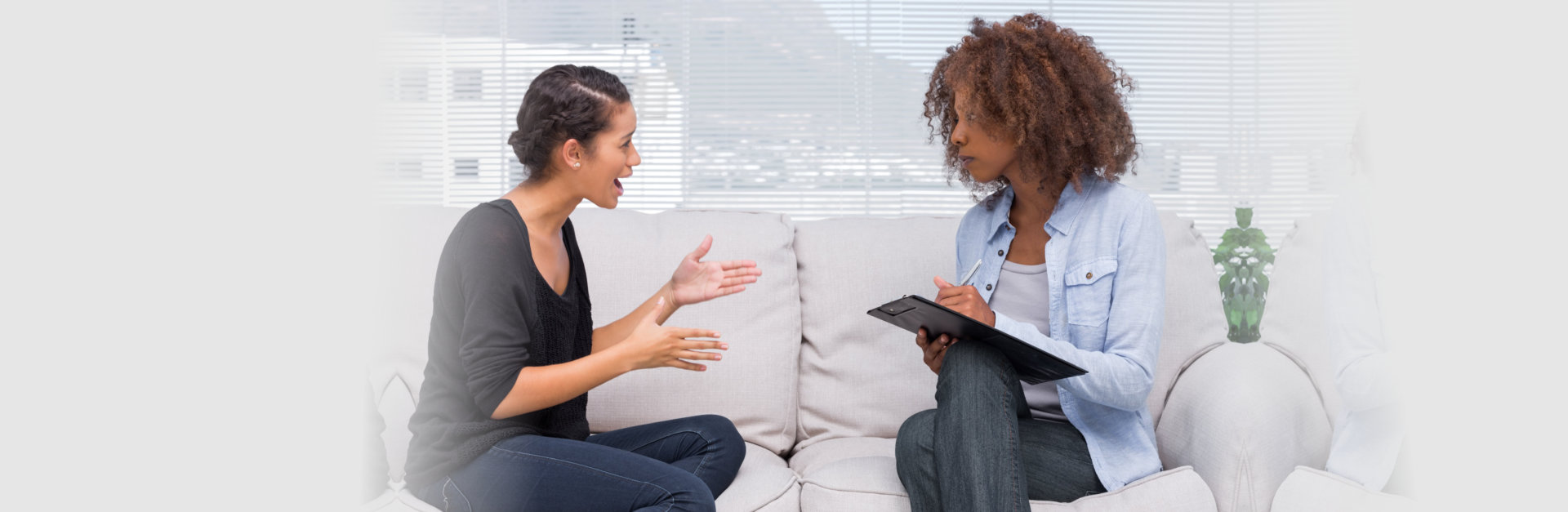 professional woman and client woman having conversation