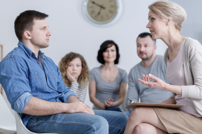 man listening on woman in counseling